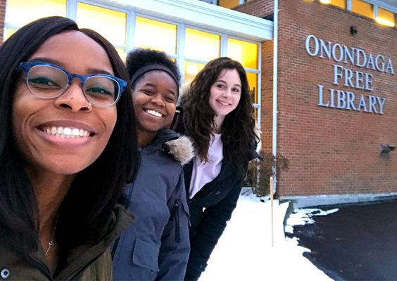 iSchool seniors Kahssia Hills, Malaika Howard and Sydney Paul outside the Onondaga Free Library, where they helped start a new chapter of Girls Who Code.