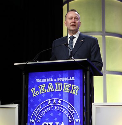 man at podium