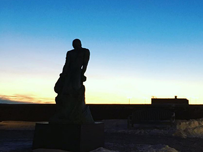 statue with sunset