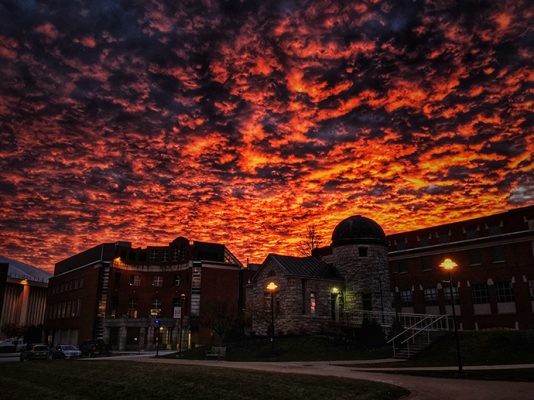 sunset over campus buildings