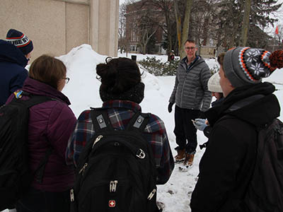 Professor David Chandler and his students studying snow on the Quad.