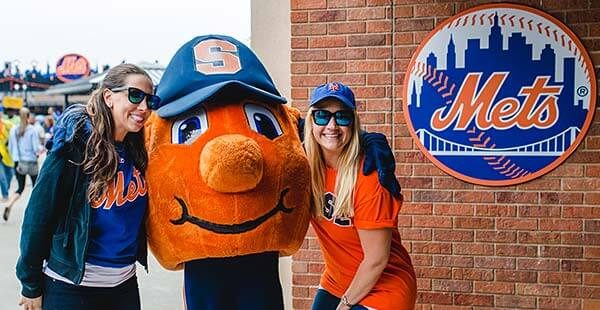 two fans with Otto the Orange
