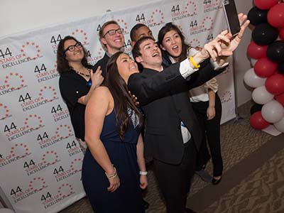 Group of students pose for selfie at 44 Stars of Excellence Awards
