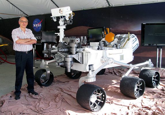 man standing with Mars rover