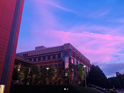 sunset over campus buildings