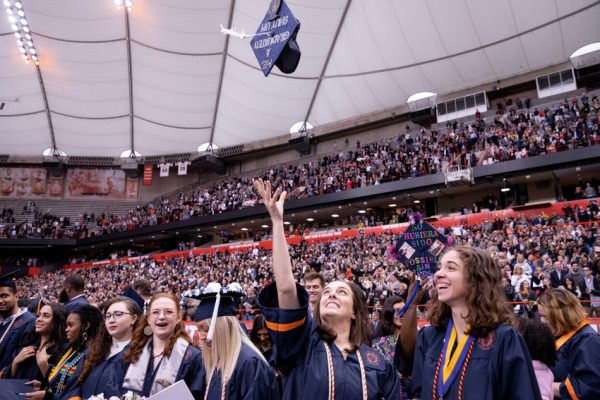 woman tossing her cap during graduation