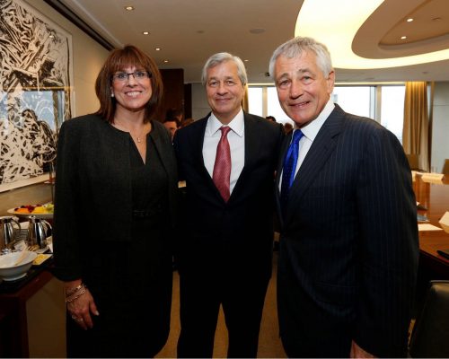 woman and two men in business suits