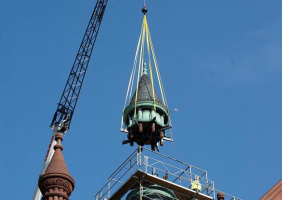 cupola being lowered by a crane