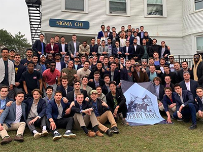 Members of Sigma Chi in front of house