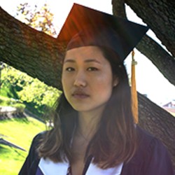 Young woman wearing mortarboard hat