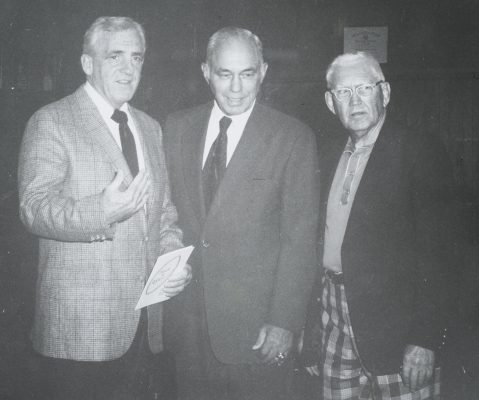 three men standing