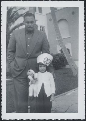man and young girl standing outside