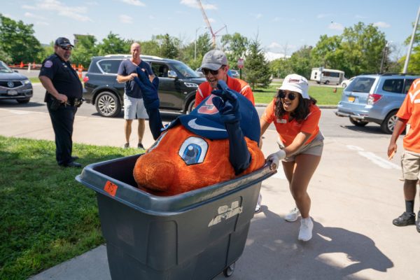 woman pushing bin with Otto