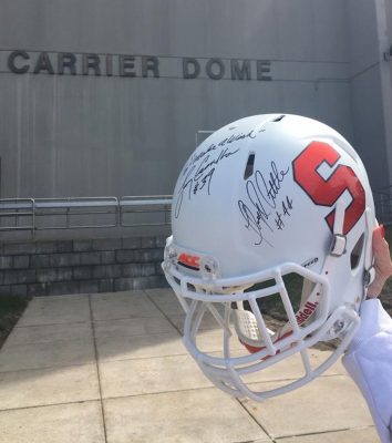 hand holding football helmet