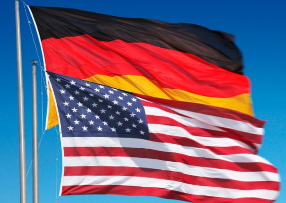 German flag and American flag waving