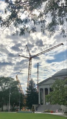 Cranes hover over Dome with Hendricks Chapel in the foreground