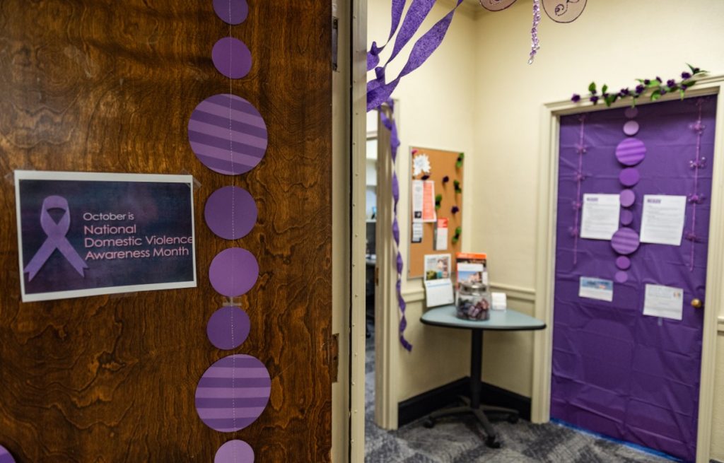 purple decor and sign in office