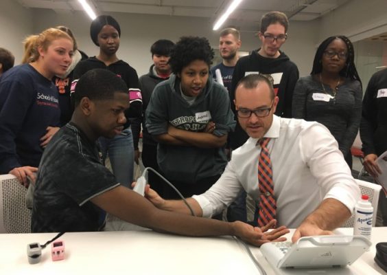 Exercise Science students engage in learning with a professor