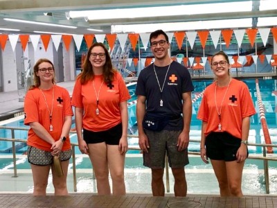 student lifeguards in front of pool