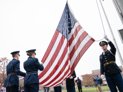 Cadets raising the American flag outside Hendricks Chapel