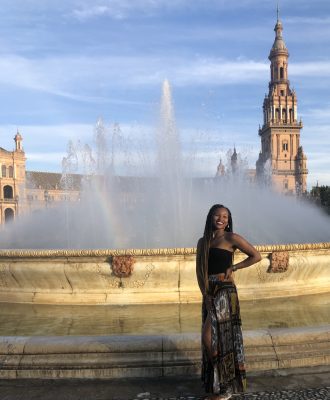 woman standing in front of fountain