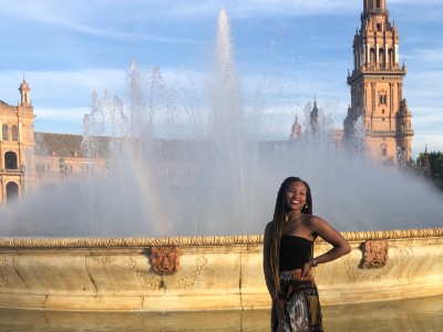 woman standing in front of fountain