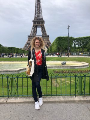 woman standing in front of Eiffel Tower