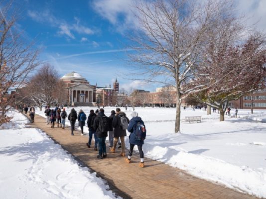 people walking on campus path