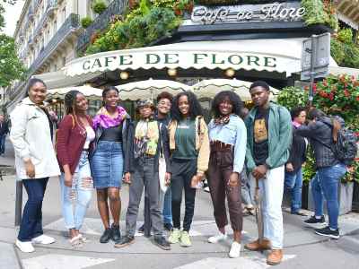 students outside a paris cafe