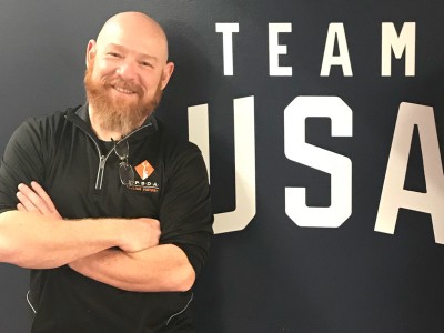 Man standing with Team USA sign