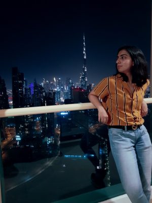 woman standing in front of city scape
