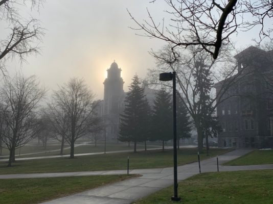 fog over campus buildings