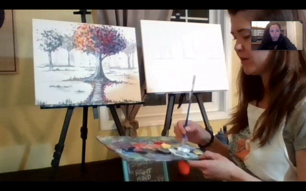 Artist with a paint brush and canvas