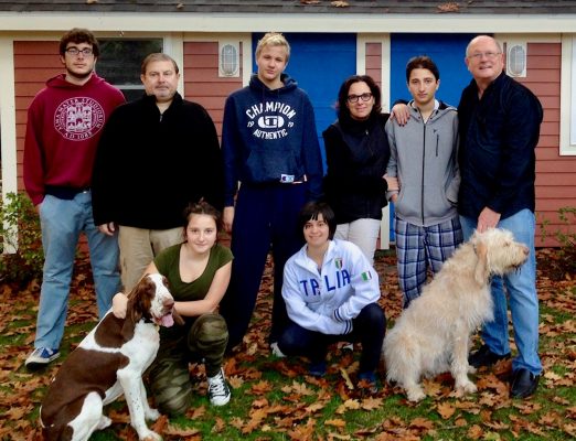 Eight family members with two dogs