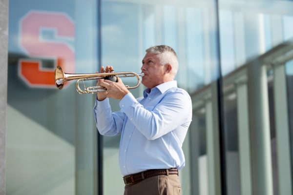 man blowing horn