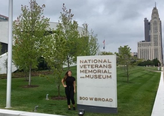 student Laura Buys poses at the National Veterans Memorial Museum