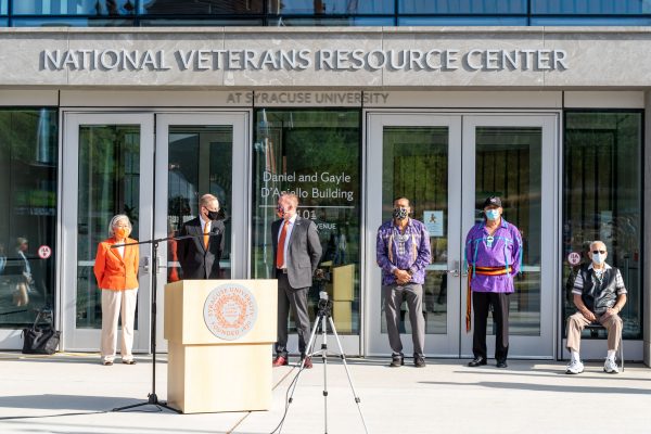 people standing behind podium