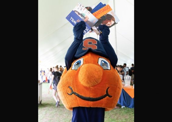 Otto holding brochures at Syracuse Abroad Day Fall 2019
