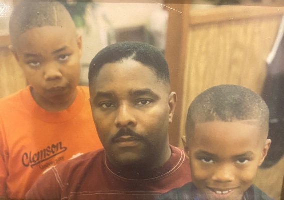 childhood photo of LaShan Lovelace, father Ronald, and brother Jamar