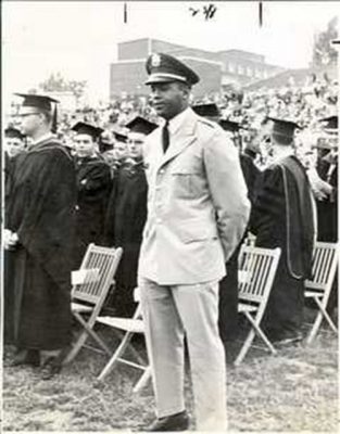 Ernie Davis in uniform standing at graduation