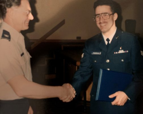 two people in uniforms shaking hands