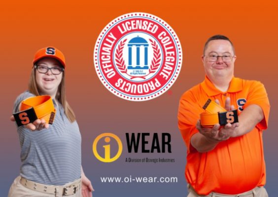 two individuals wearing/holding Syracuse University-branded merchandise