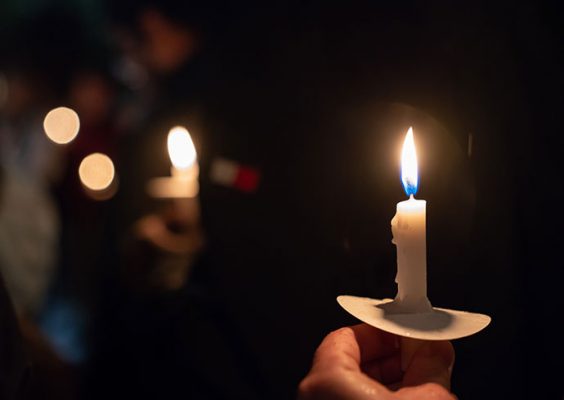 candle being held in a hand