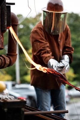 Doctoral candidate Chris Sant works with lava