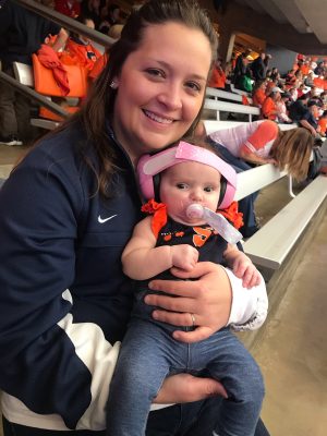 Courtney Albiker and daughter Addison at stadium