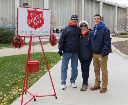 Mark, Joanne and Brian Balduzzi ringing the bell for Salvation Army on campus
