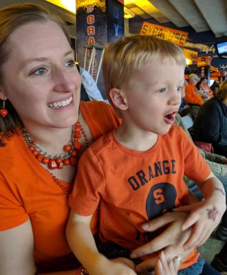 Kate Ludwig with her son at the stadium
