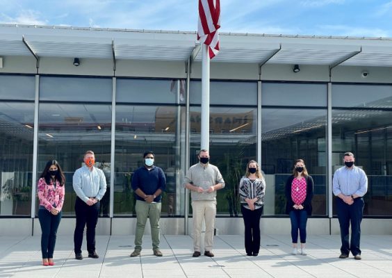 group of people standing in front of building