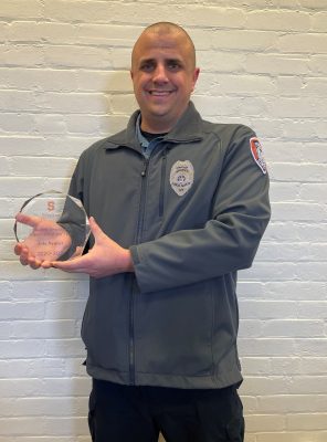 person holding award