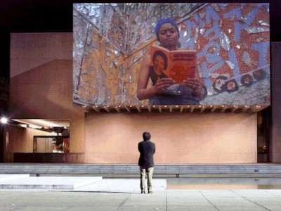 a projection of Fluid Frontiers by Ephraim Asili at the Everson Museum Plaza